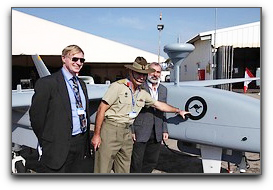 Australian military attache next to Heron 1 UAV